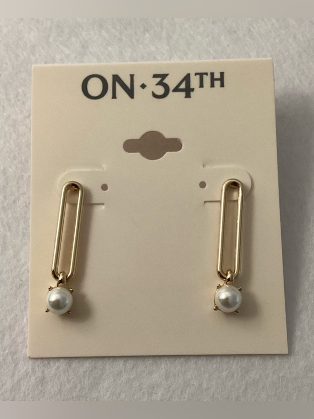 On 34th Gold Drop Earrings with White Pearl Accent
